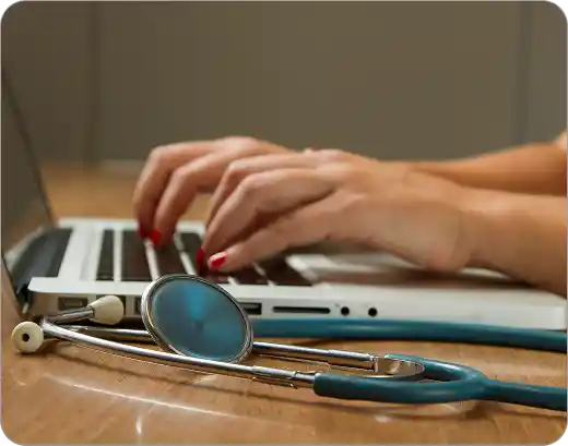 Medical student studying with laptop and stethoscope during 1 on 1 USMLE tutoring session with expert USMLE tutor online